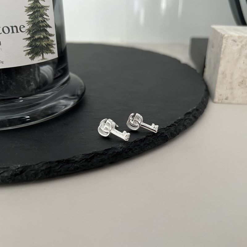 G*u*i earrings